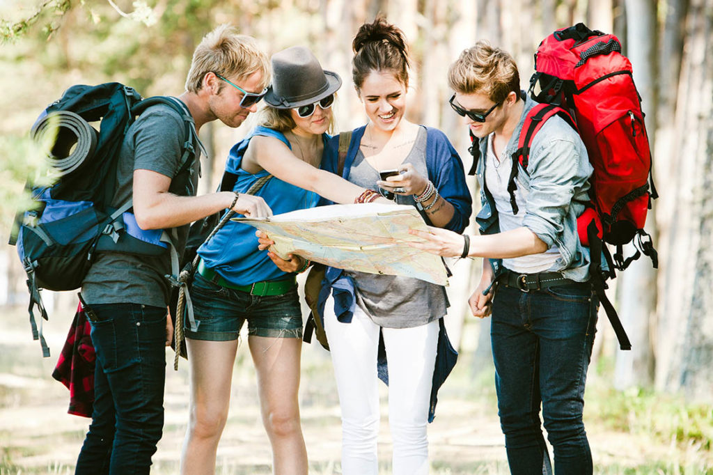 Collaborative Budgeting Tools: Group of friends planning a trip together